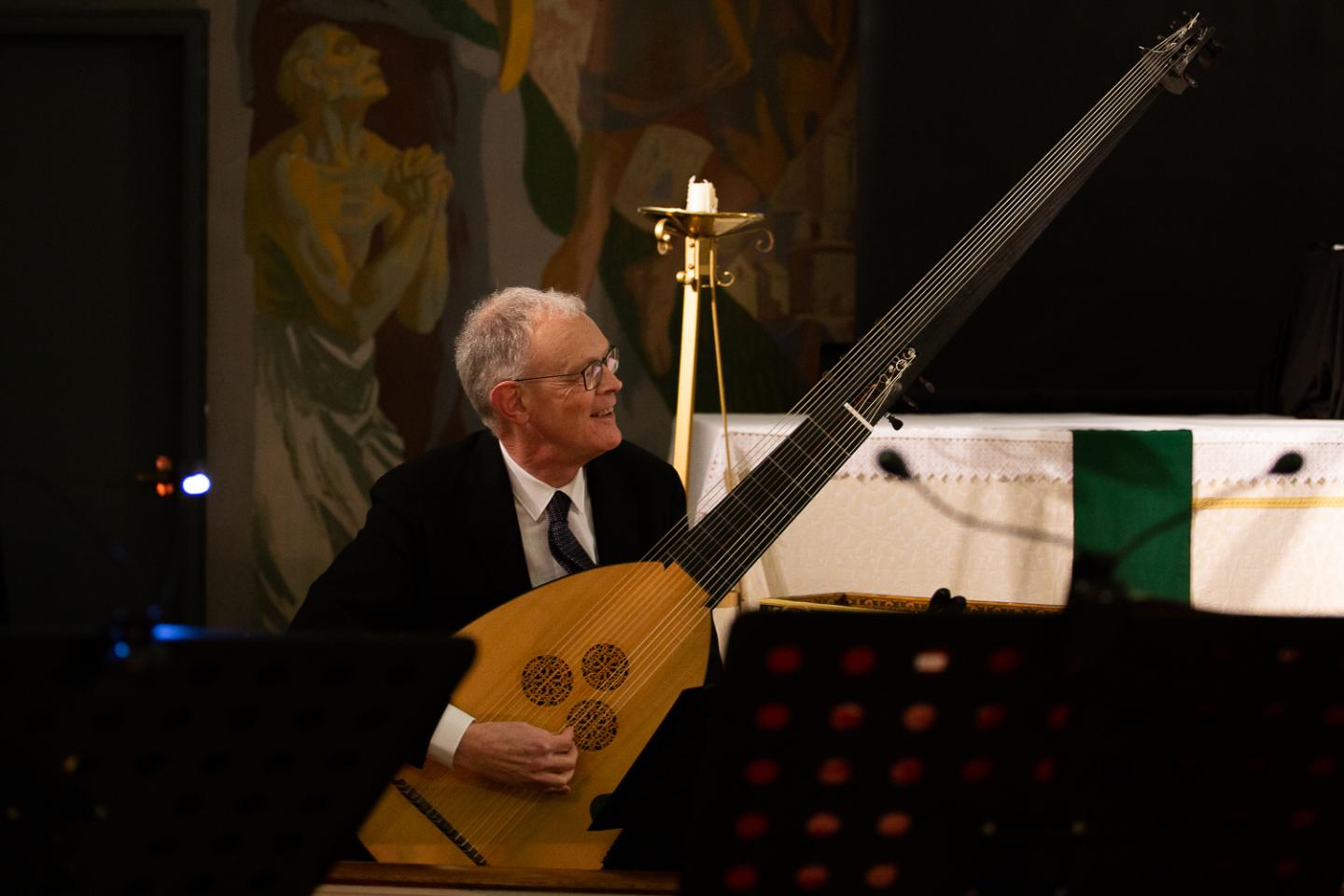 Image of a man playing a period instrument