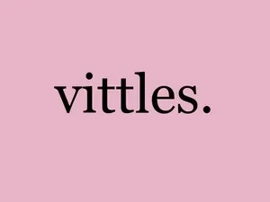 Logo which is a pink square with the word Vittles written in black times new roman font