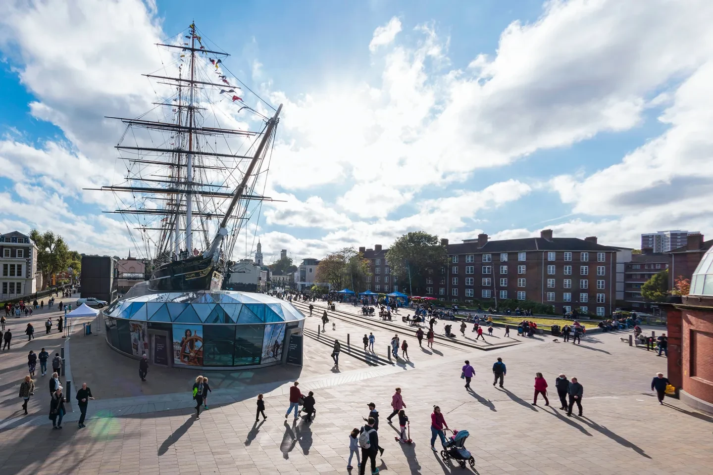 View of Cutty Sark and people walking around the ship