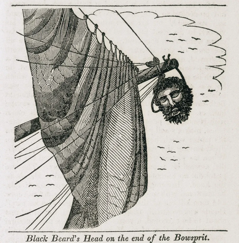 Illustration in black and white showing a bowsprit on the front of a ship with a man's head hanging off of it