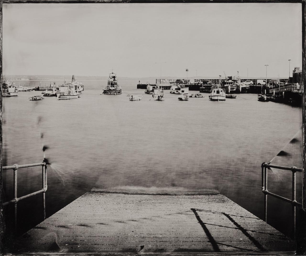A black and white photo of the slipway at Ballycotton RNLI Lifeboat Station