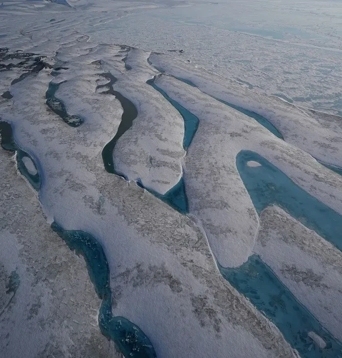 The Milne Ice Shelf photographed from above where it meets the ocean 