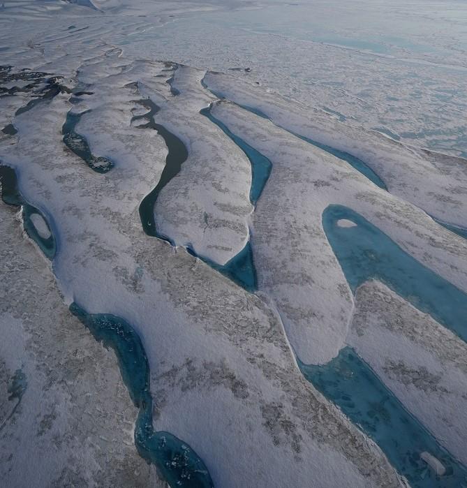 The Milne Ice Shelf photographed from above where it meets the ocean 