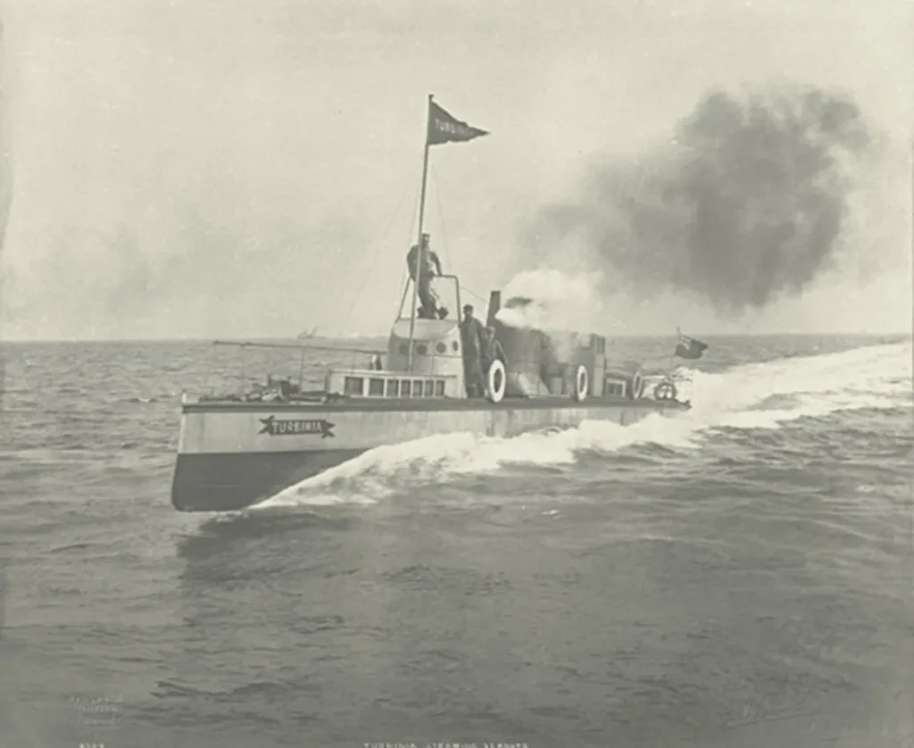 Historic black and white photograph showing experimental steam turbine-powered ship Turbinia