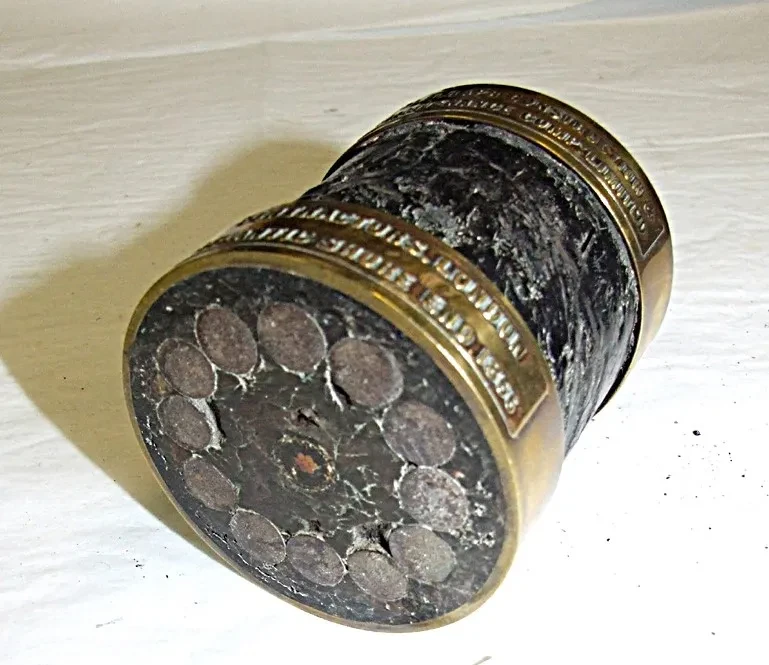 A photograph of a section of the transatlantic cable, revealing the circular arrangement of thick wires within.