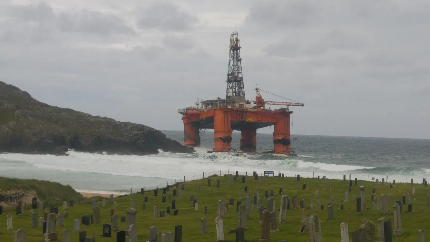 A huge offshore drill rig aground off the coast of Scotland