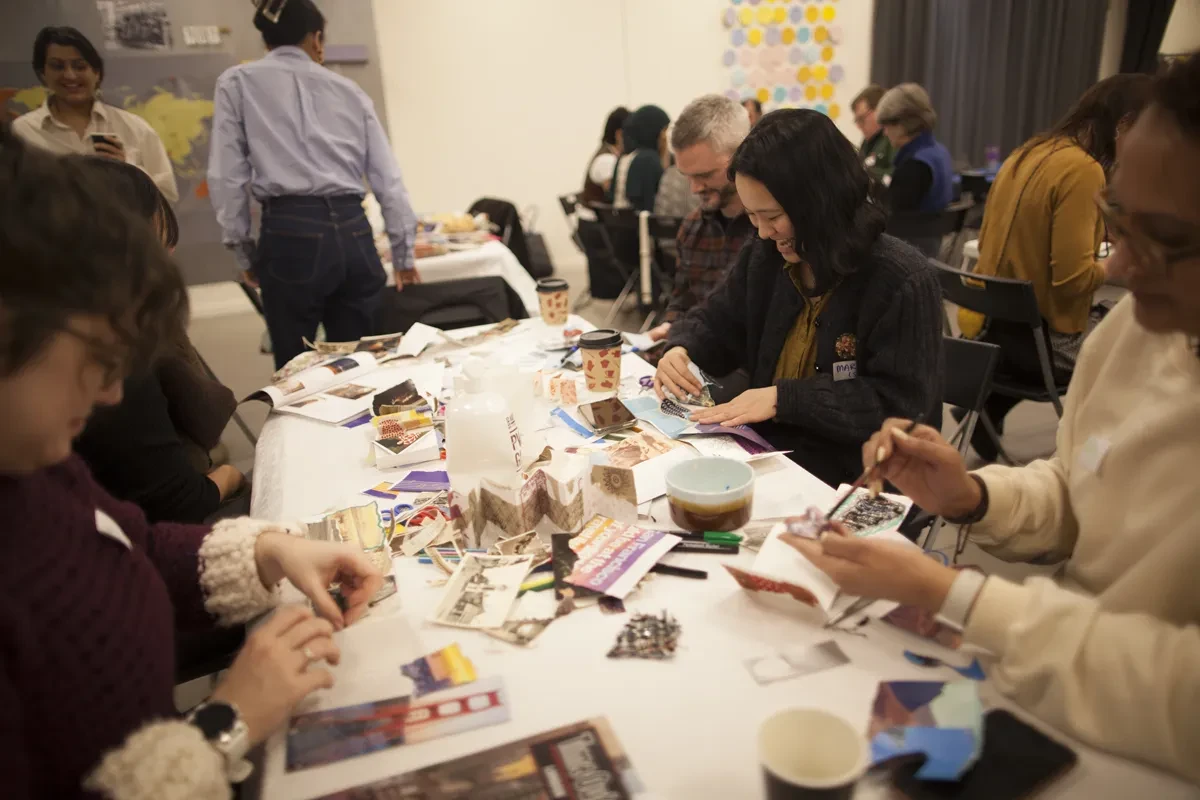 Photo of group of people doing crafts at a large table