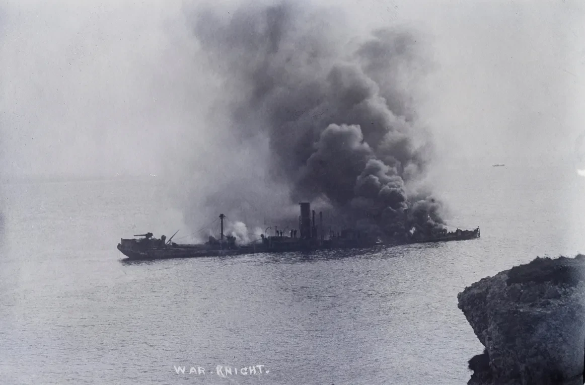 A black and white photograph of a ship on fire in Freshwater Bay, Isle of Wight