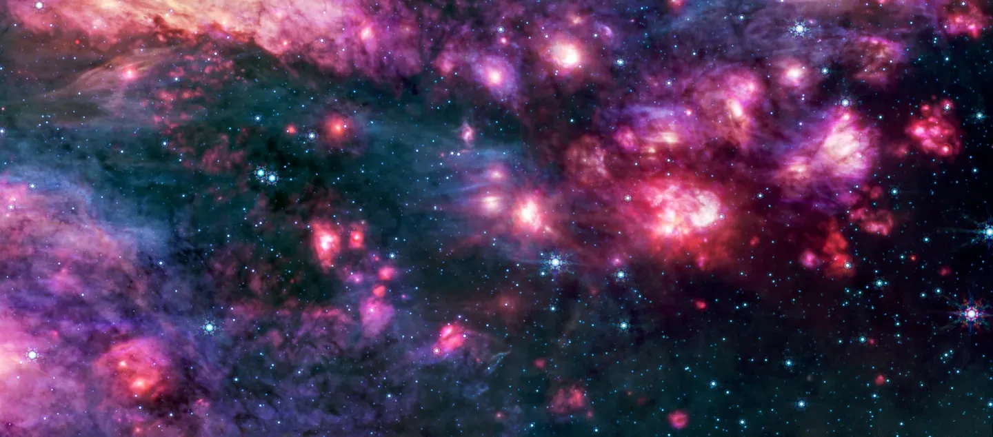 Pink and purple clouds of gas, as well as many small bright stars