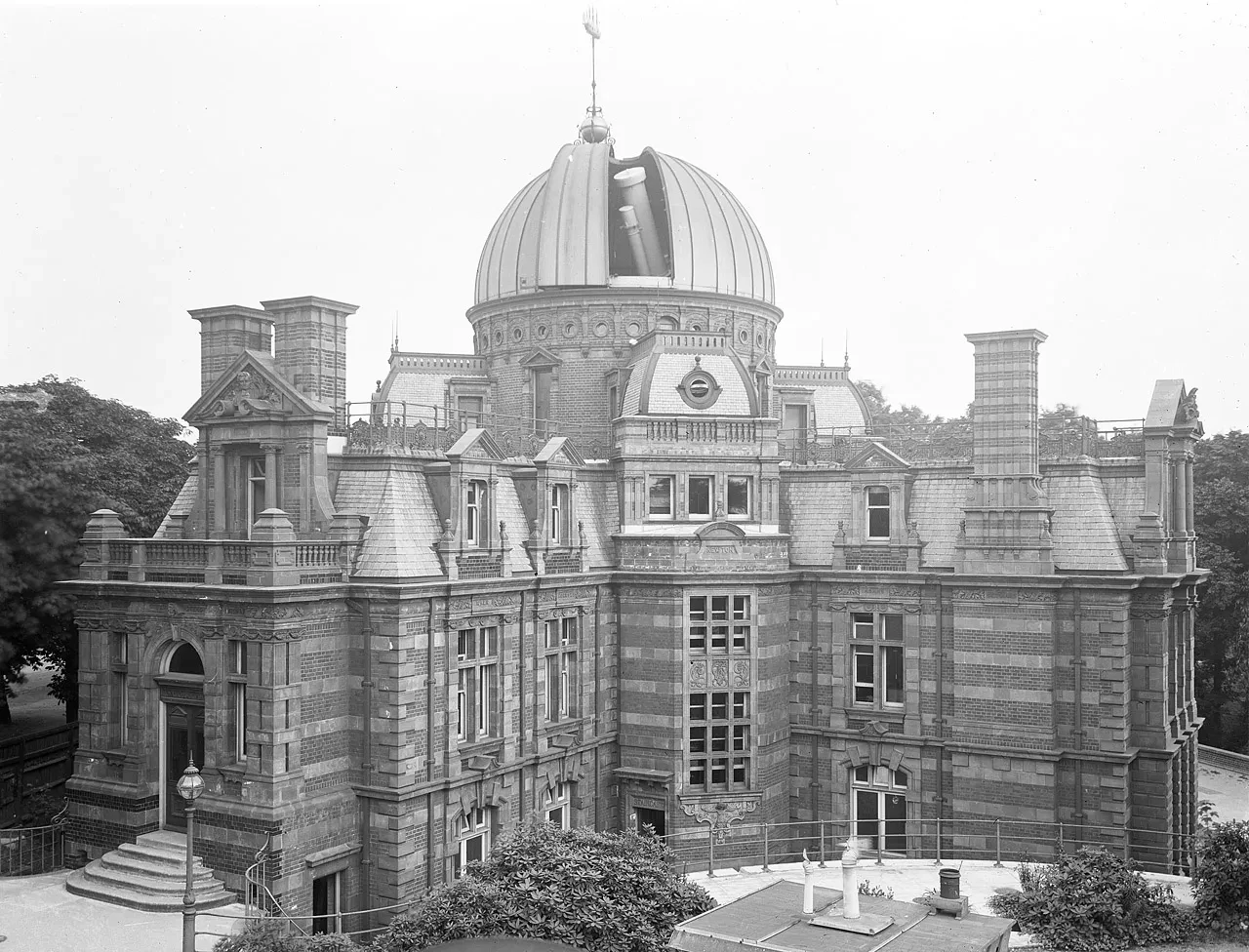 Photograph of the newly completed New Physical Observatory, later known as the South Building. The telescope can be seen through an opening in the dome.