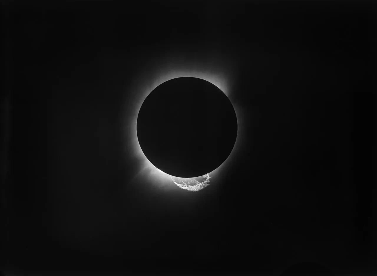 Black image with Sun being eclipsed by Moon, with only a fuzzy white ring visible