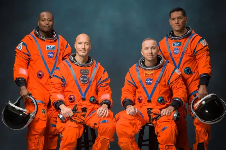 Photo of Artemis 3 crew, four men in bright orange space suits
