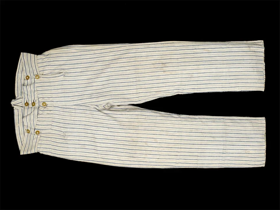 A pair of white and blue striped sailor's trousers with a high waist and seven buttons.