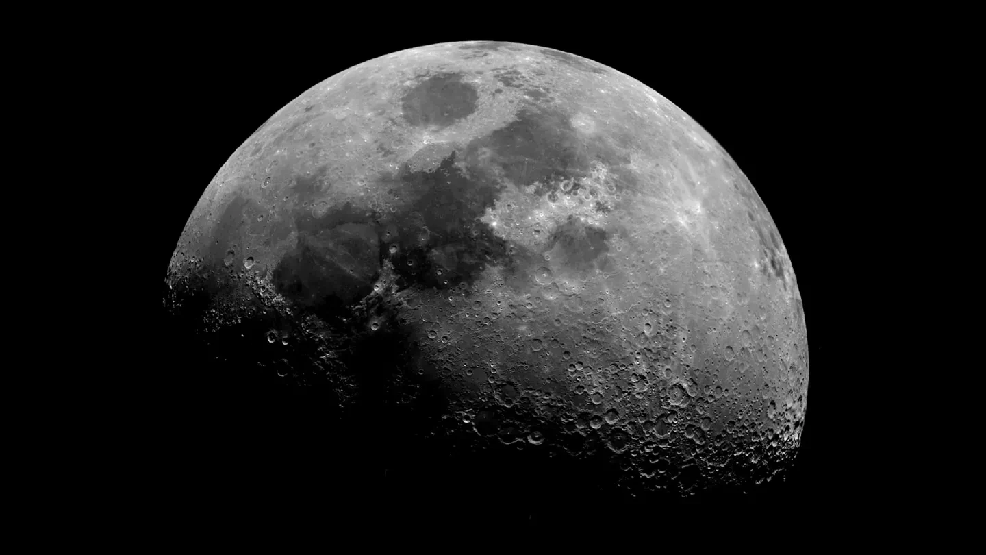 Photo of the Moon which fades into darkness at the bottom