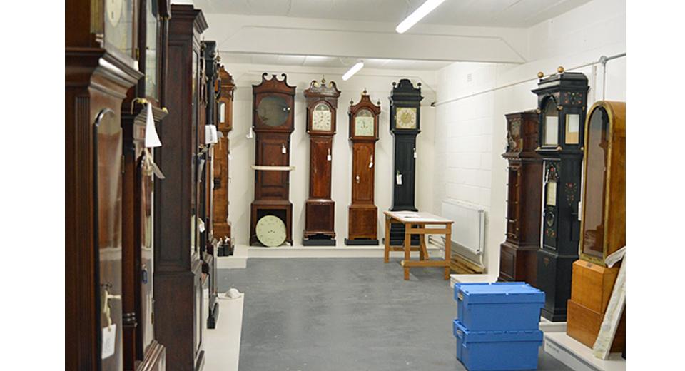 View of the clock store during reassembly by Rory McEvoy (Curator of Horology) and Anna Rolls (Conservator of Scientific instruments)