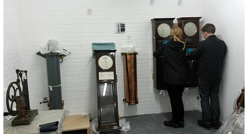 Rory and Anna installing clocks and tanks for Shortt master and slave clock systems No 40 and  No 16