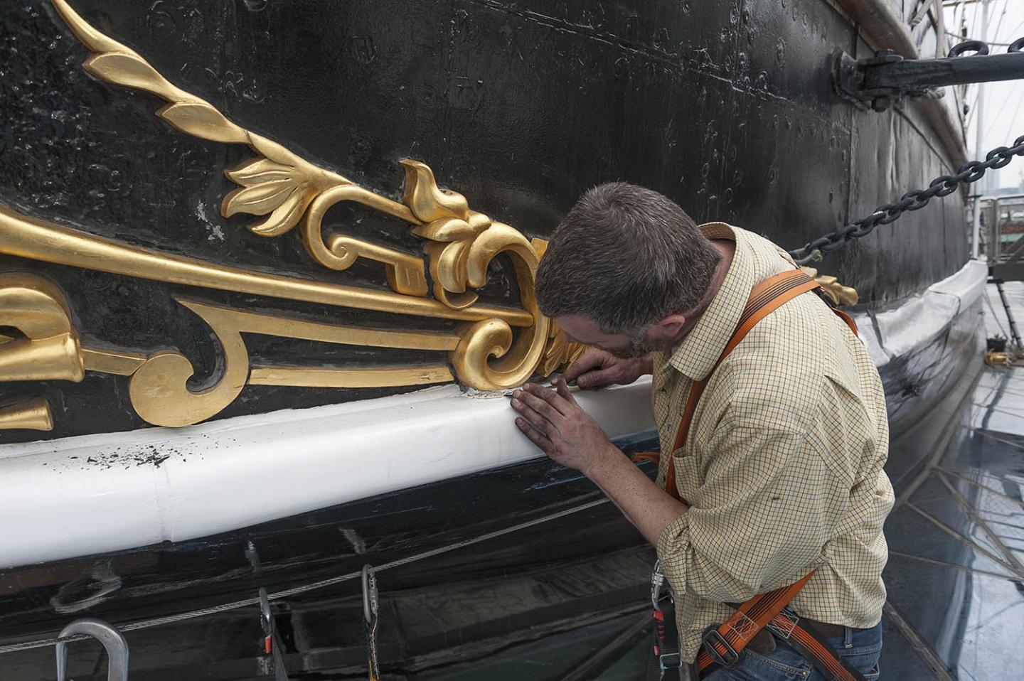 Cutty Sark gilding being removed for restoration