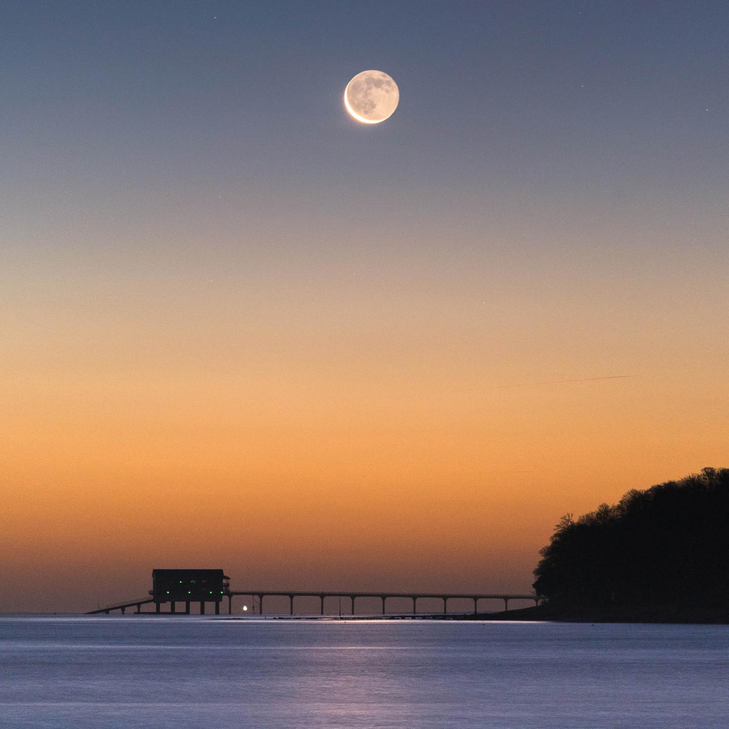 Earthshine over Bembridge Lifeboat Station © Ainsley Bennett