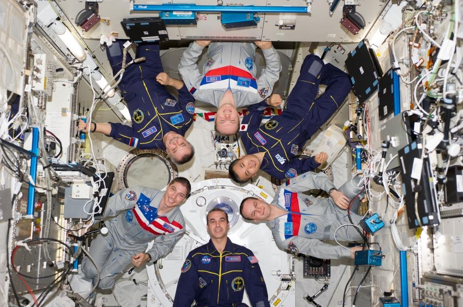 Expedition 38 crew members pose for an in-flight crew portrait in the Kibo laboratory of the International Space Station on Feb. 22, 2014