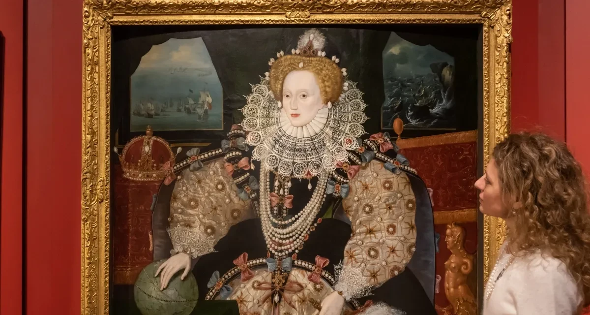 A visitor looks at the Armada portrait of Elizabeth the first.