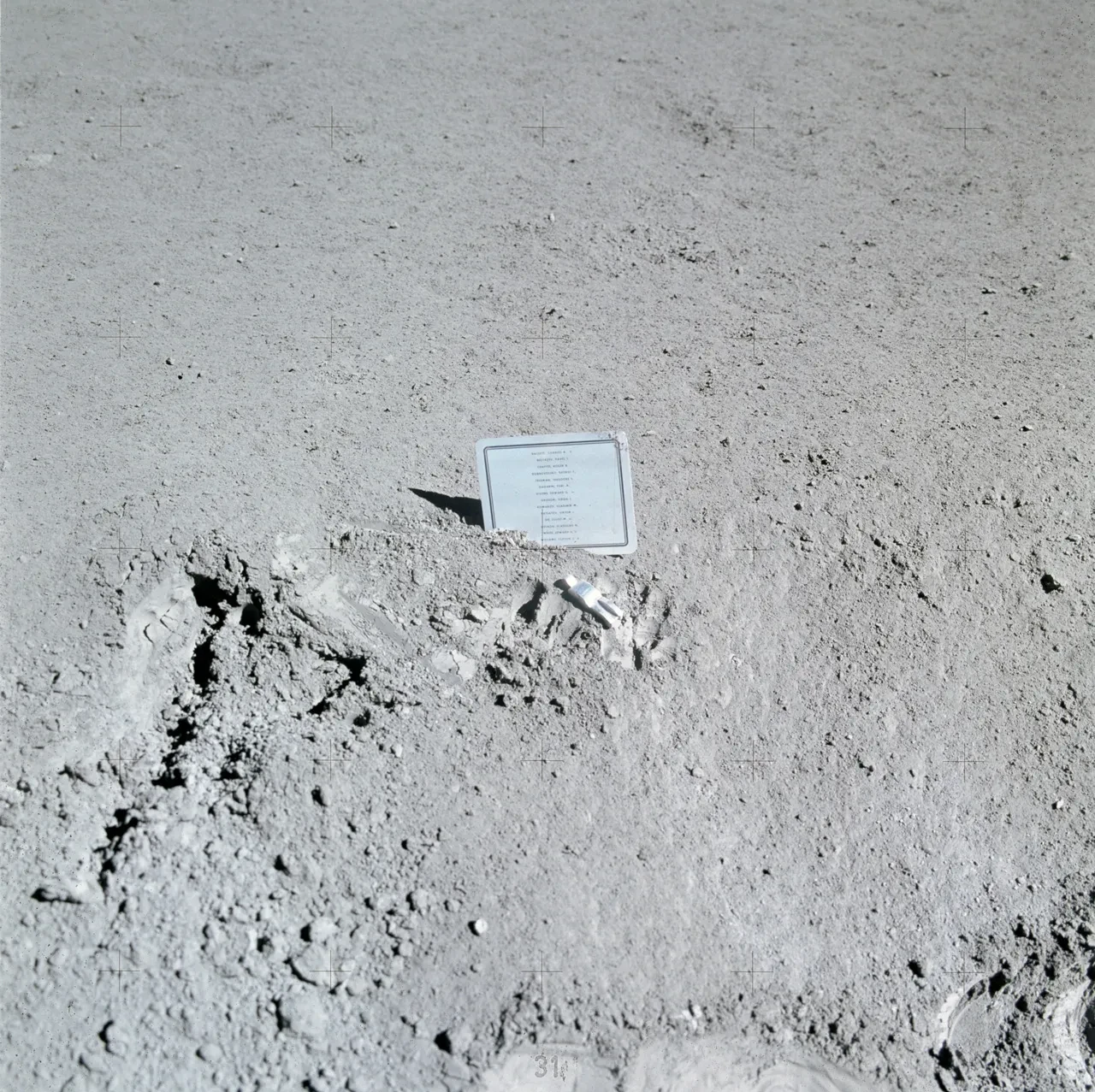 A plastic-wrapped printed list of names on the surface of the Moon.