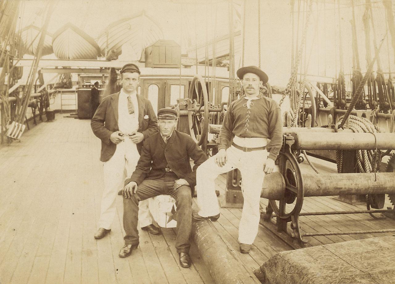 Third Mate James Weston (left) with James Robson the Cook (right) and another crew member c. 1888. 