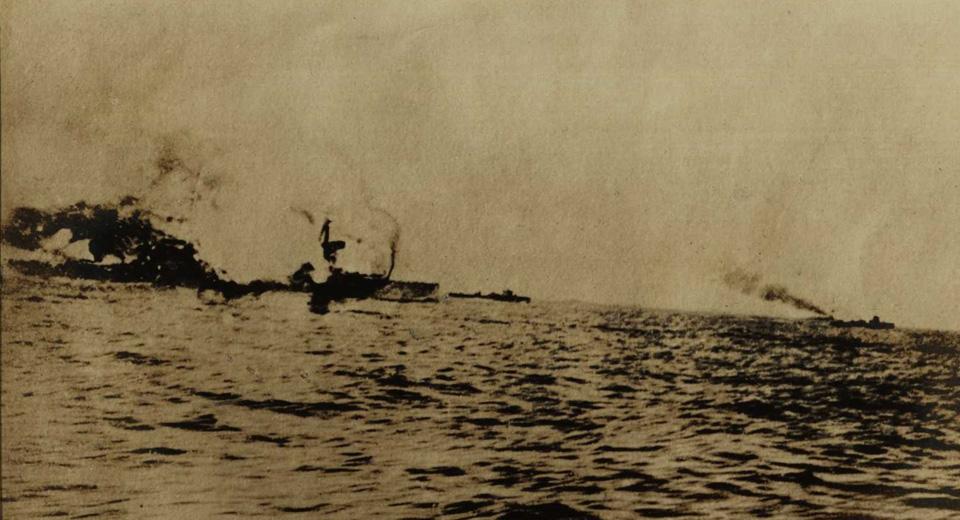 Photograph of HMS Invincible hit by enemy fire at Jutland – RMG ID item: COW/5/3