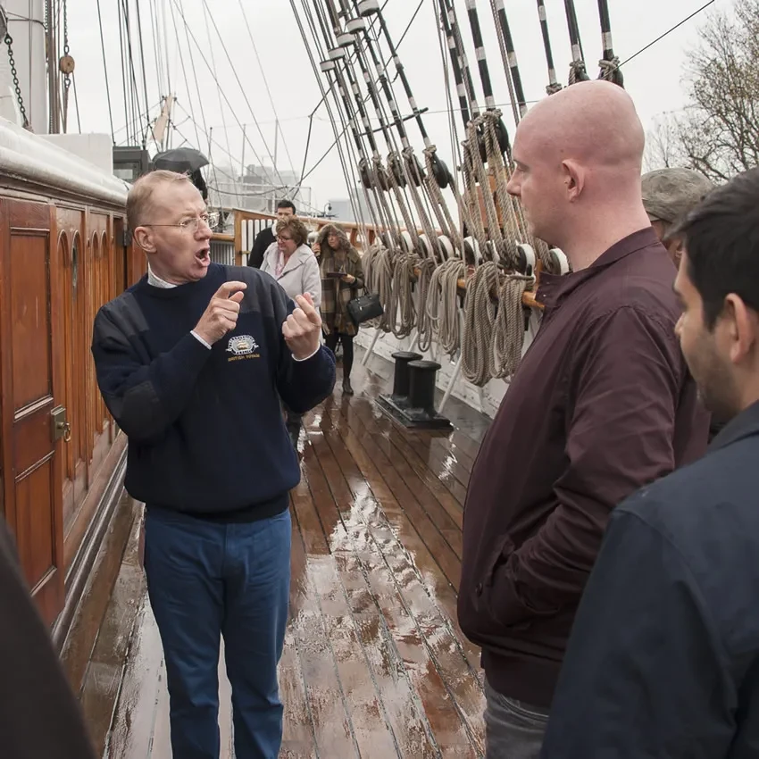 A ship tour guide using British Sign Language.