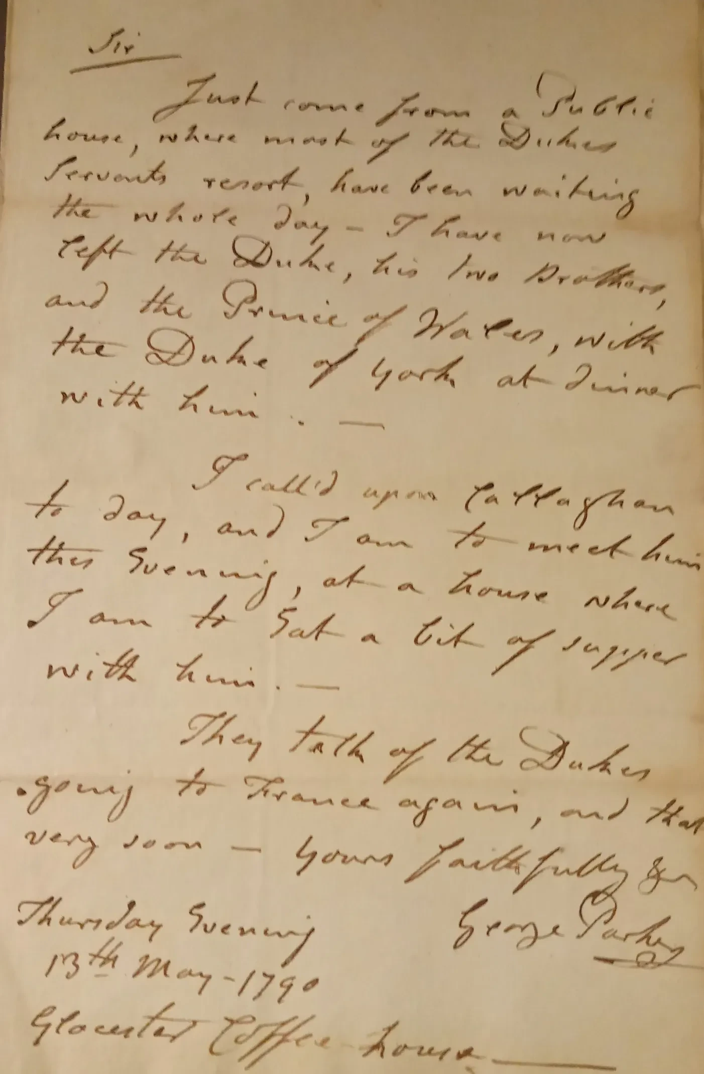 Handwritten letter on brown paper.