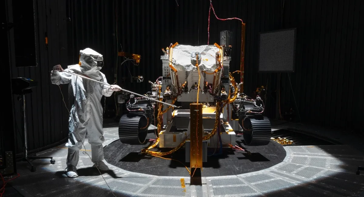 A Mars rover and a NASA worker.