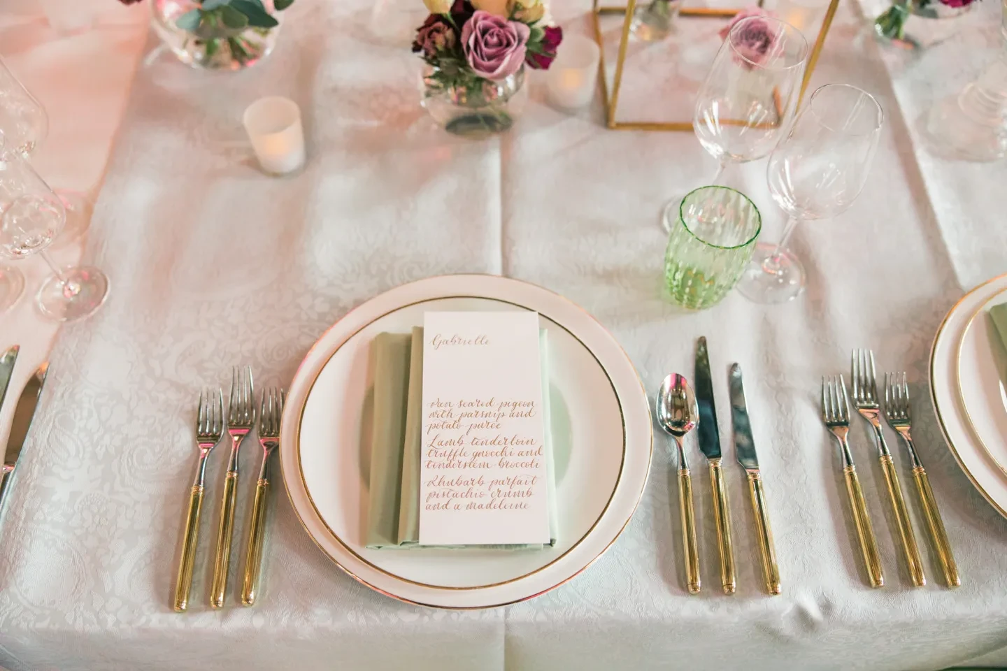 Gold and white formal table setting.