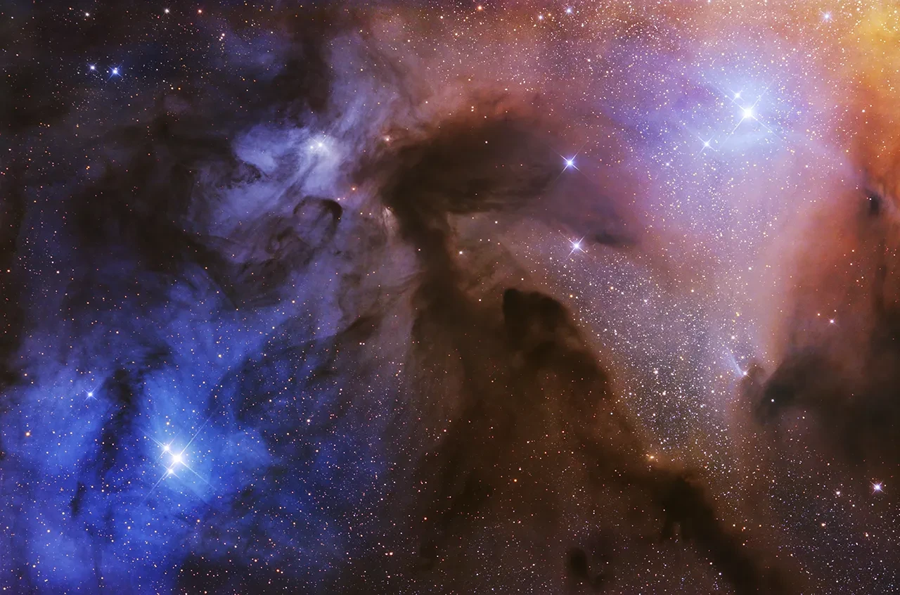 Colourful astronomy photograph of a nebula with bright stars.