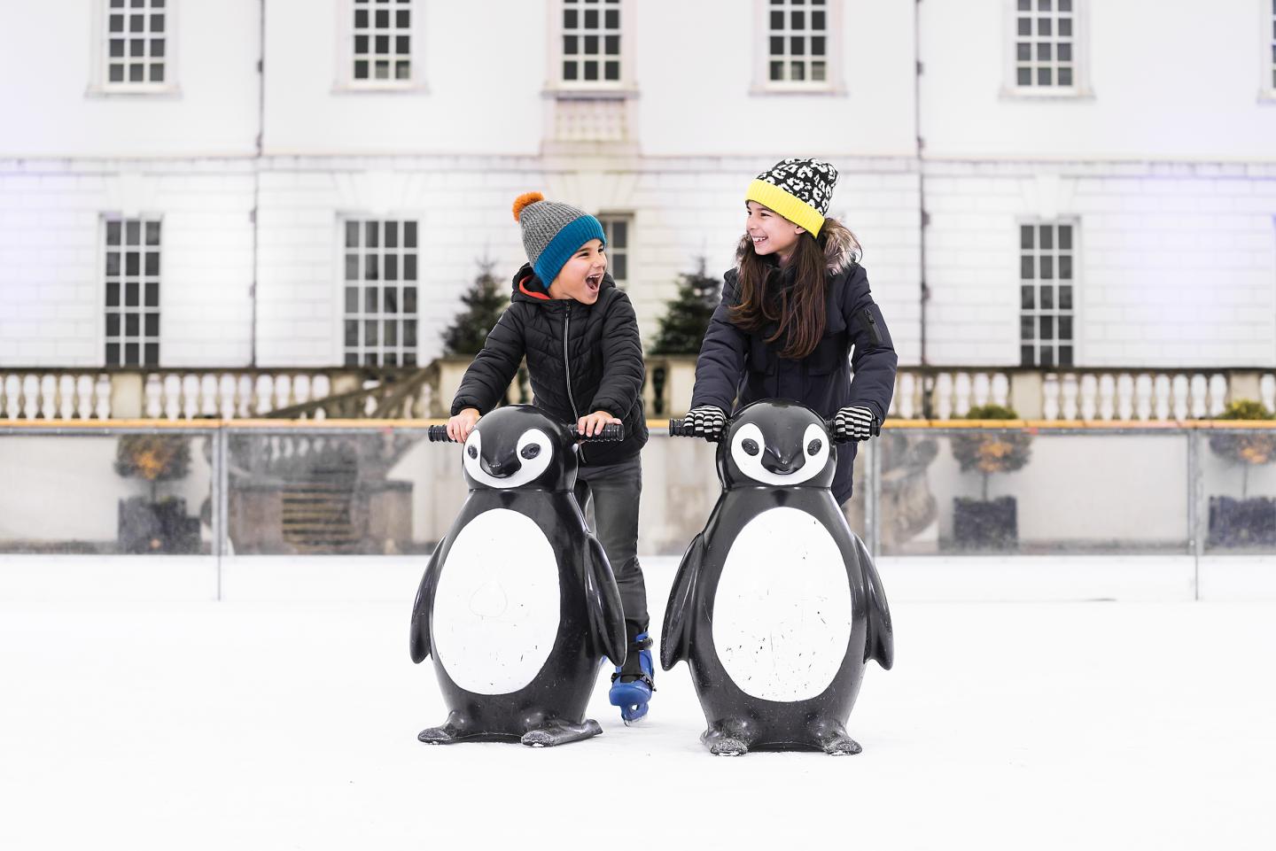 Two children skating at the Queen's House Ice Rink