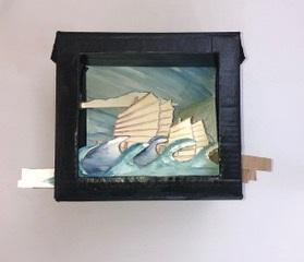 A family craft activity to make a theatre made from a cardboard box with painted waves and a ship sailing across the stage