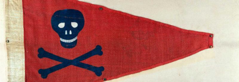 A red flag with blue skull and crossbones