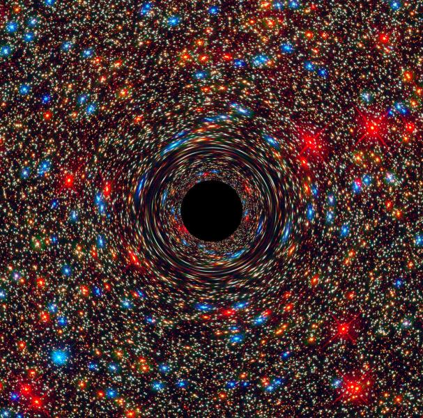 A computer-simulated image shows a supermassive black hole