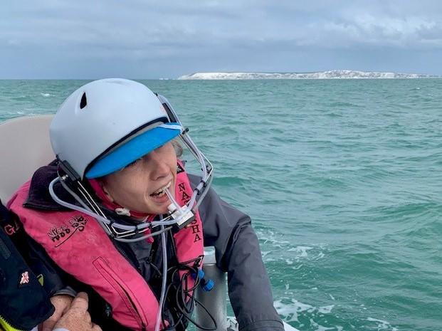 Natasha Lambert sailing using a 'sip-puff' helmet