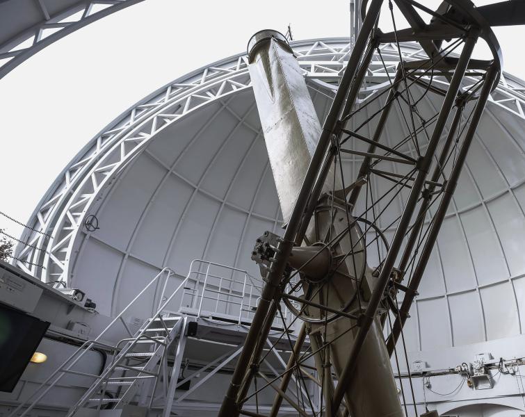 Inside the dome of the Great Equatorial Telescope at the Royal Observatory. The roof of the Dome is partially open to allow the telescope to observe the sky