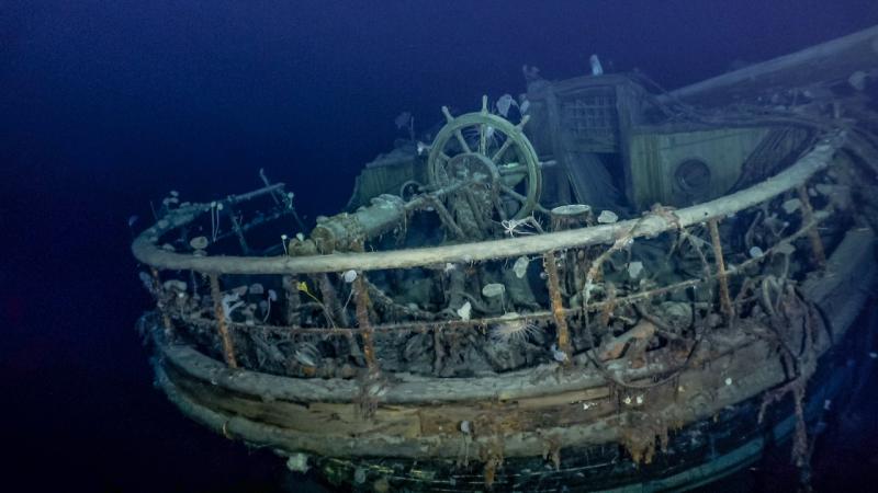 The shipwreck of Endurance, taken from footage captured during the ship's discovery. The image shows the ship's wheel and aft well deck