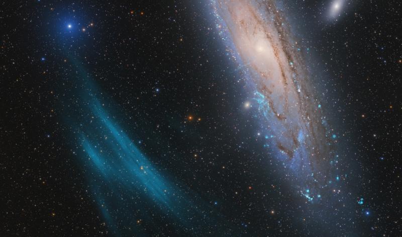 Image of turquoise curved arc or cloud next to the Andromeda Galaxy