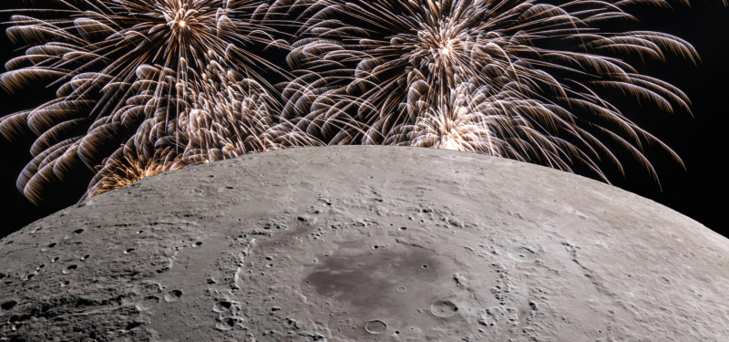 Close up view of the Moon with gold fireworks in the background
