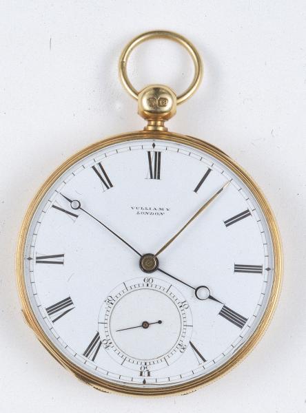 An image of a gold watch with a large face with roman numeral numbers on it, and two watch hands